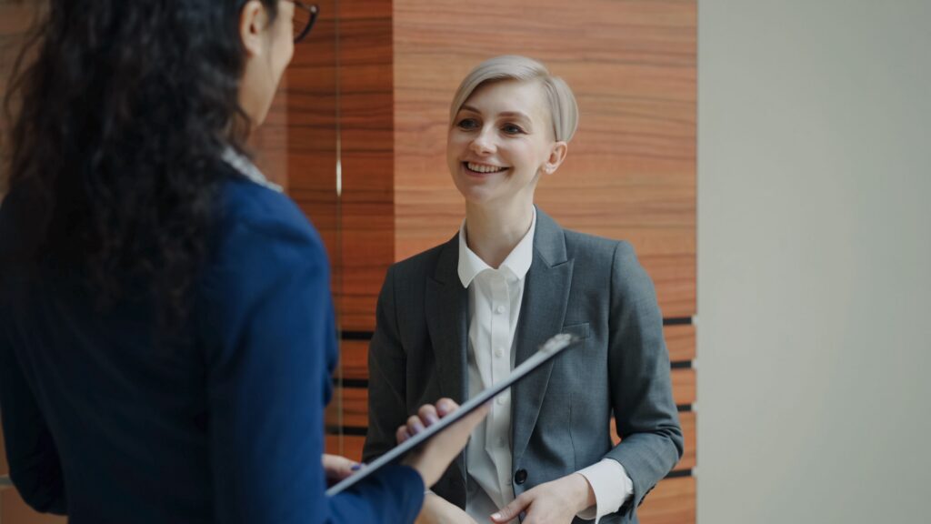 Two coworkers having a supportive conversation during a workplace accommodation discussion