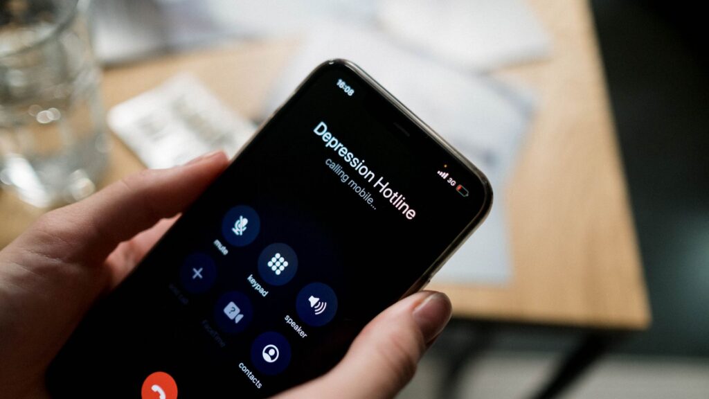 A person on a phone call, illustrating employee assistance program support