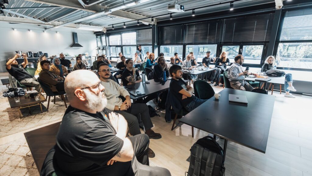 A group of professionals attentively participating in a workplace training session
